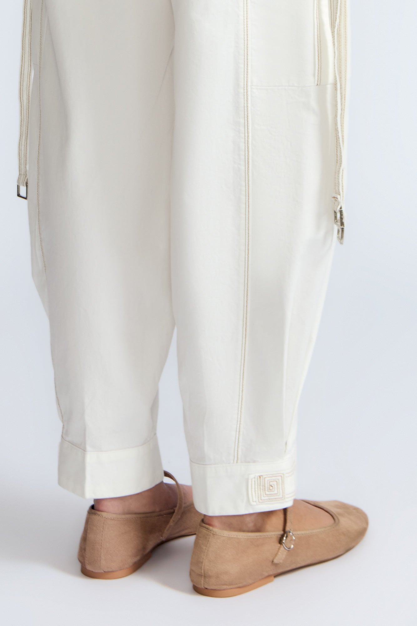 Paloma Pant in Off White – Relaxed cotton pants with patch pockets, contrast stitching, and side ties for a chic silhouette.
