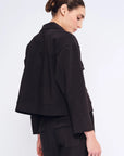 Elegant back view of the black Parker Jacket, highlighting its clean, tailored lines.