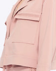 Close-up of the soft, raised gathered detail on the flap pocket of the Rose Parker Jacket.