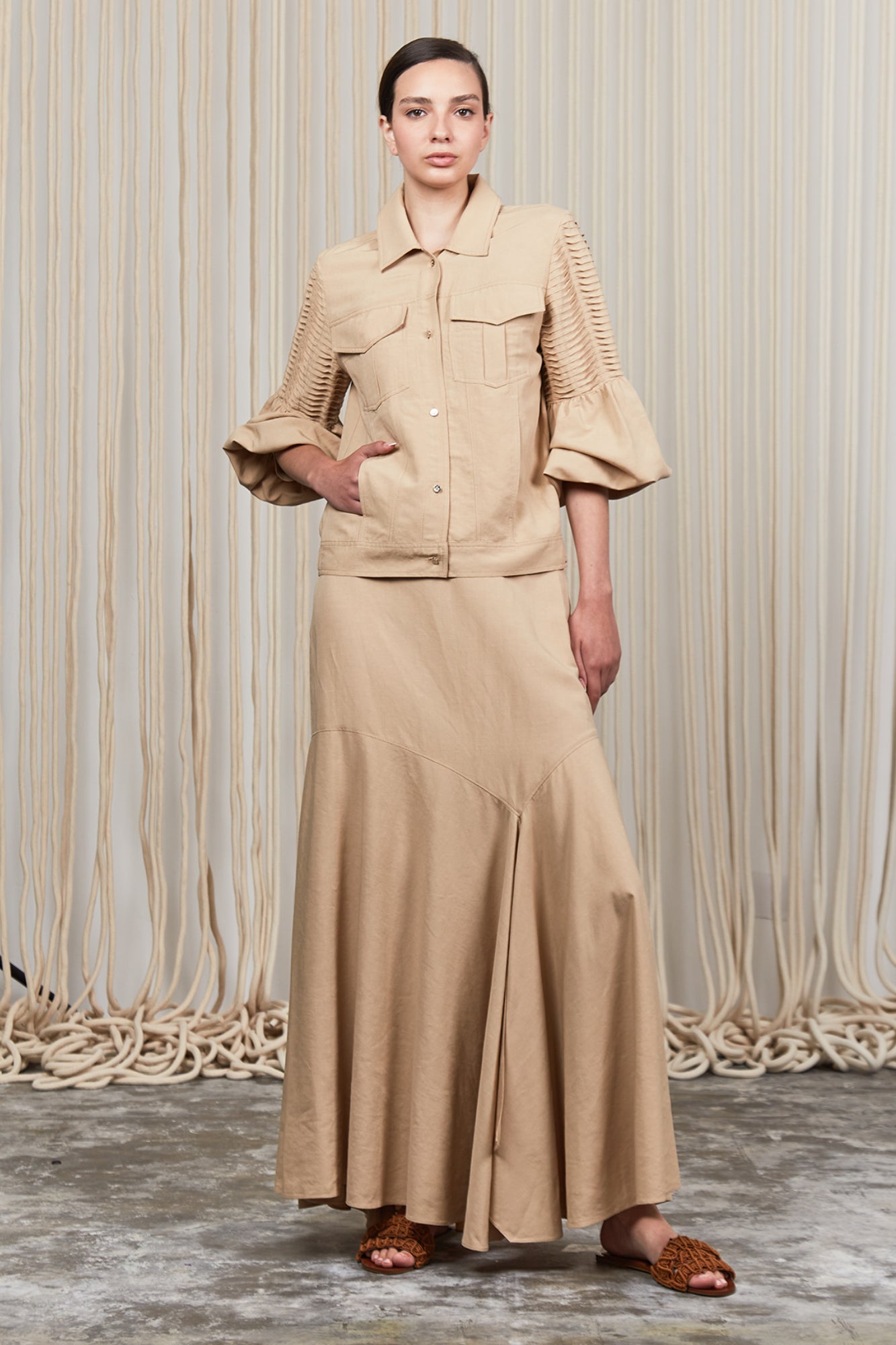 Penny Skirt in Camel with a high-waisted flowing design, ideal for versatile styling and timeless elegance.