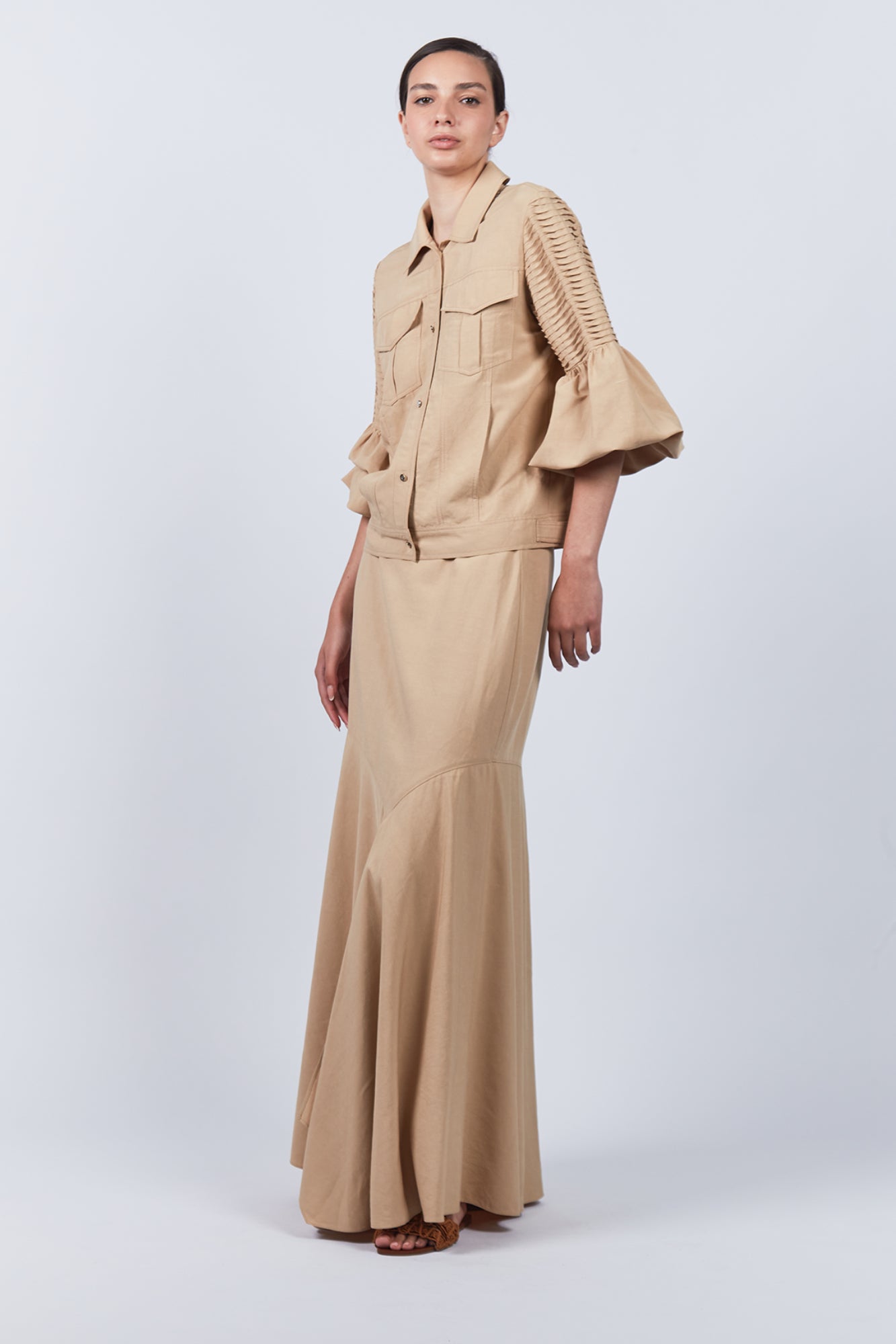 Penny Skirt in Camel with a high-waisted flowing design, ideal for versatile styling and timeless elegance.