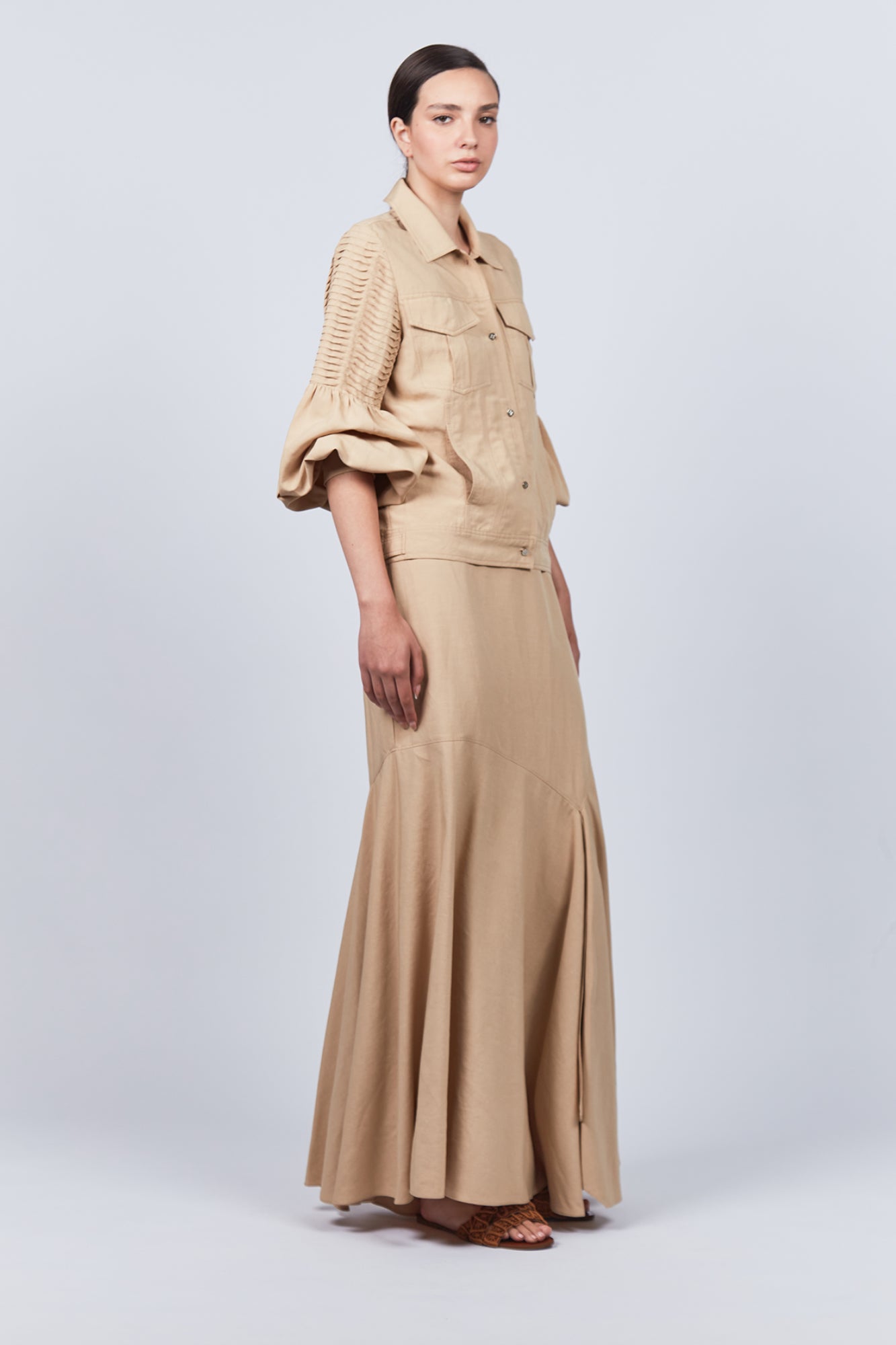 Penny Skirt in Camel with a high-waisted flowing design, ideal for versatile styling and timeless elegance.