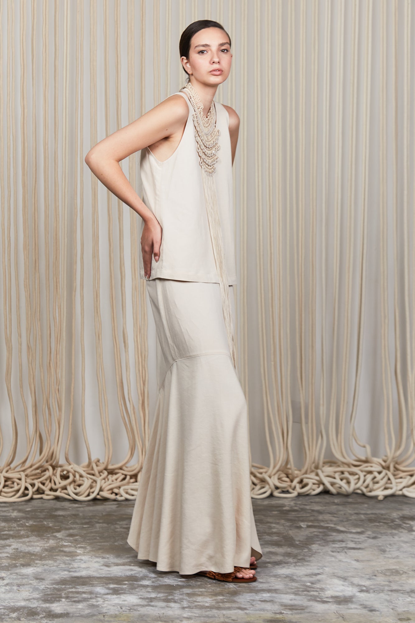 Penny Skirt in Ecru featuring a high-waisted flowing silhouette, perfect for versatile and elegant styling.