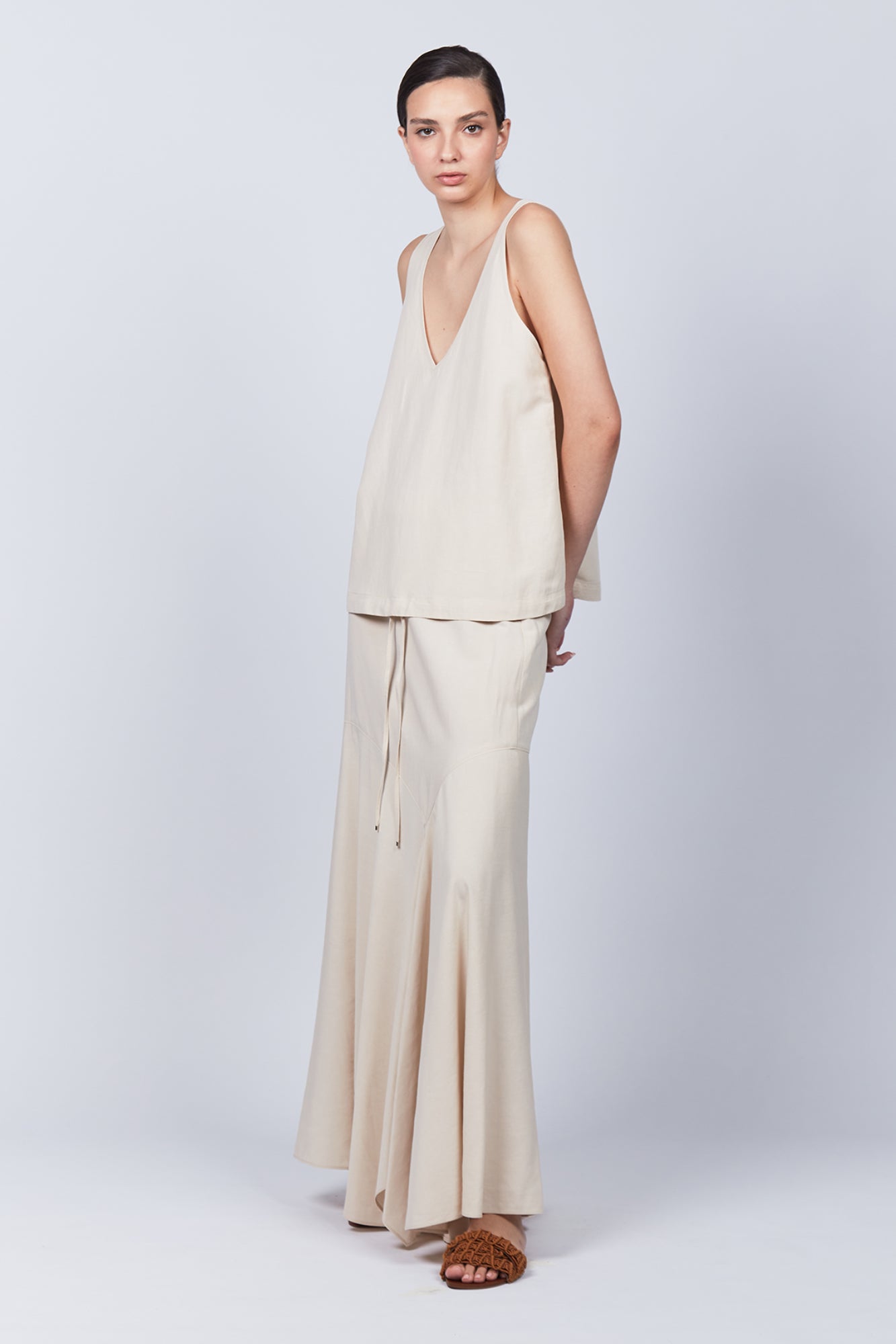 Penny Skirt in Ecru featuring a high-waisted flowing silhouette, perfect for versatile and elegant styling.