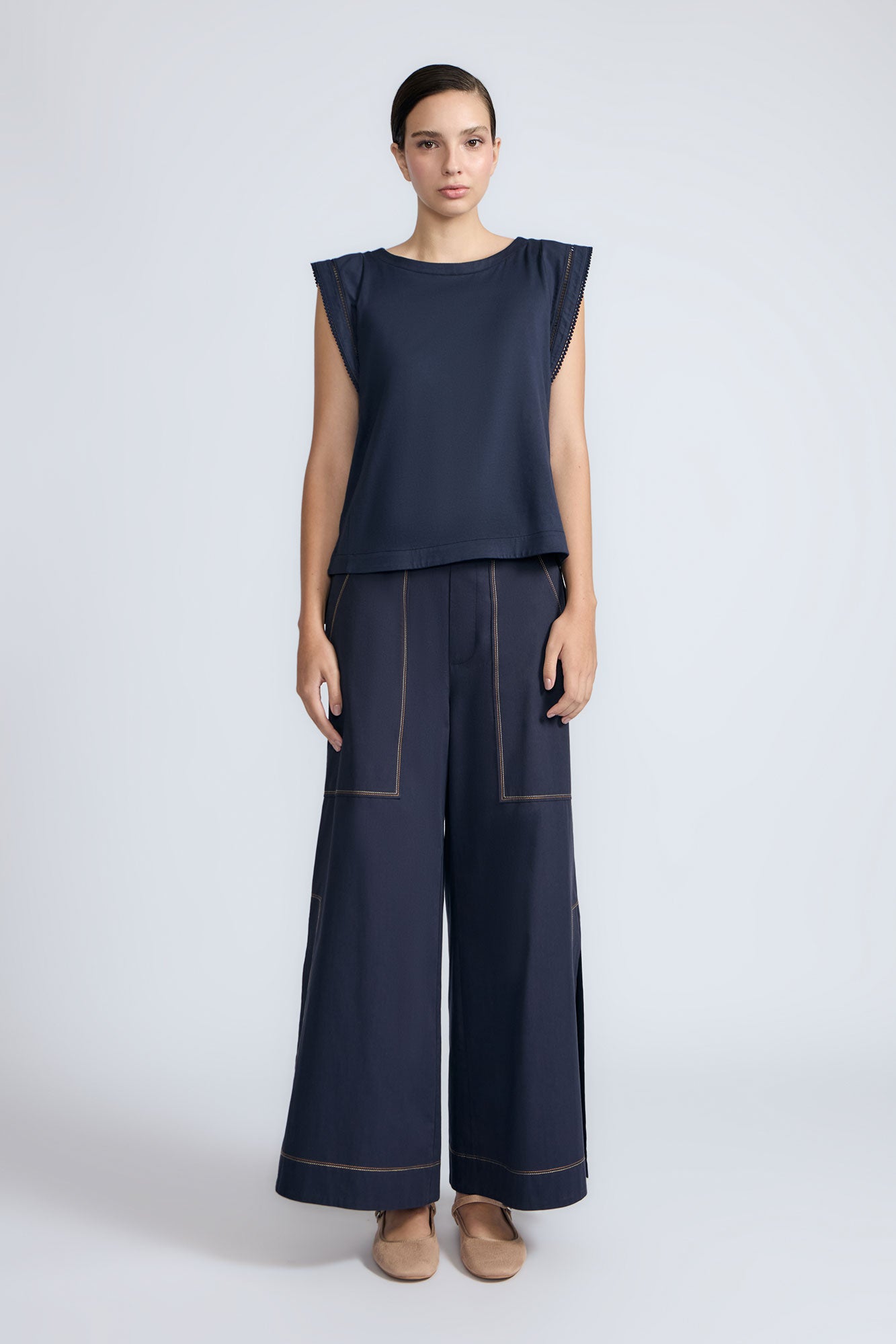 Regina Top in Navy – Soft knit top in 100% Pima cotton with round neck, Greca lace detail, dropped sleeves, and side slits.