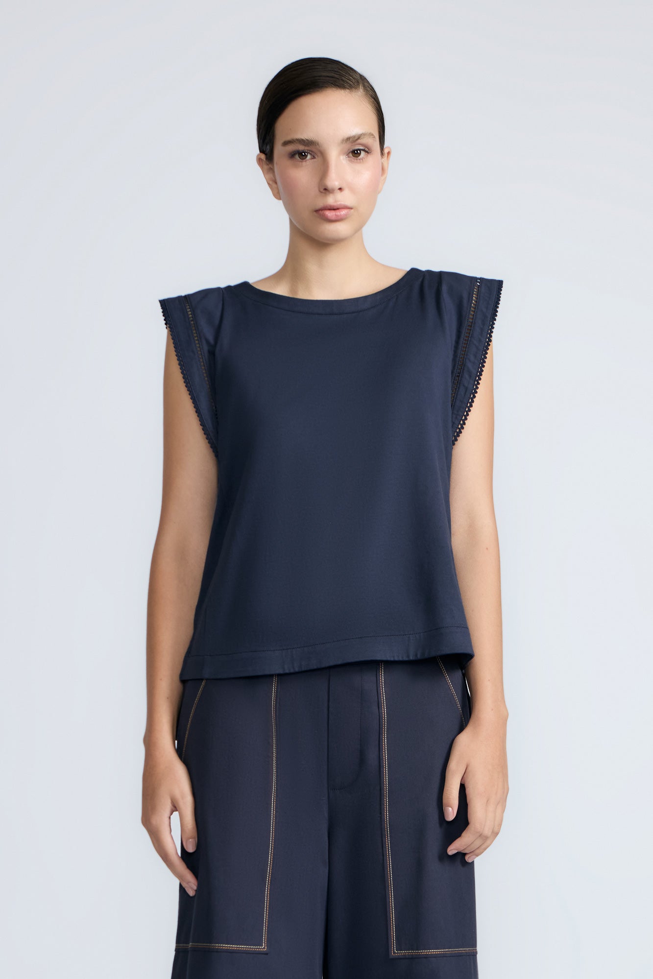 Regina Top in Navy – Soft knit top in 100% Pima cotton with round neck, Greca lace detail, dropped sleeves, and side slits.