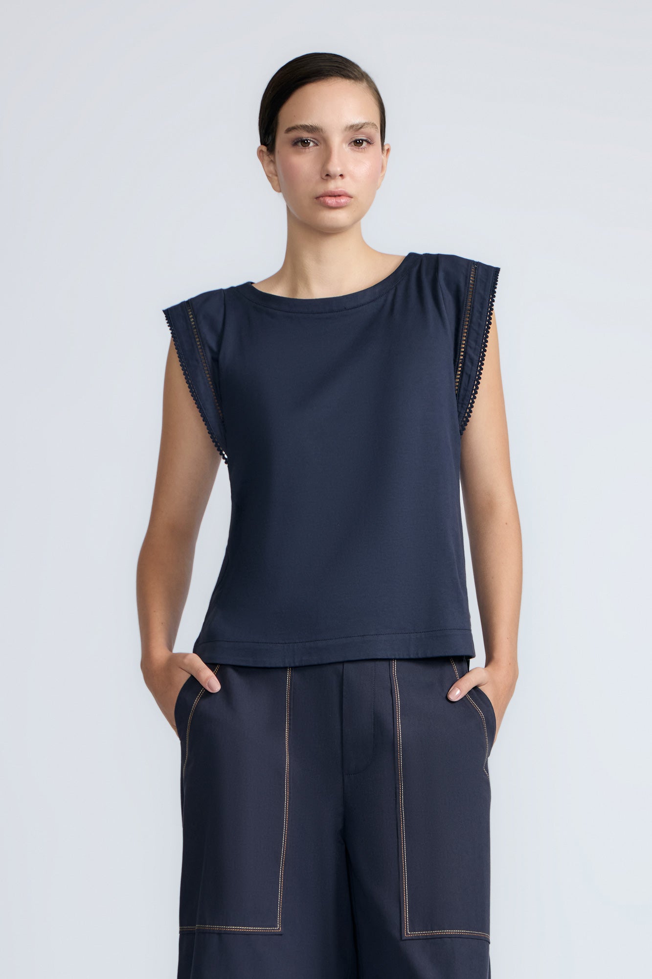 Regina Top in Navy – Soft knit top in 100% Pima cotton with round neck, Greca lace detail, dropped sleeves, and side slits.