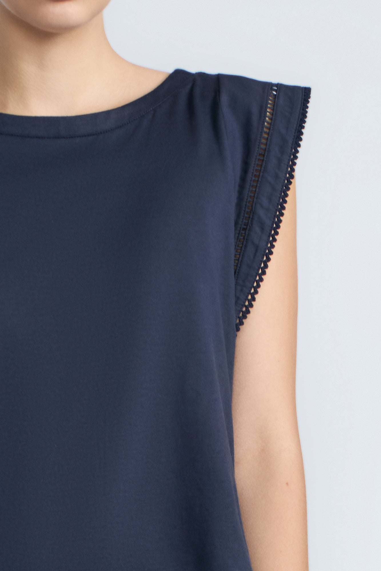 Regina Top in Navy – Soft knit top in 100% Pima cotton with round neck, Greca lace detail, dropped sleeves, and side slits.