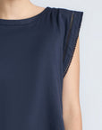 Regina Top in Navy – Soft knit top in 100% Pima cotton with round neck, Greca lace detail, dropped sleeves, and side slits.
