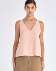 Front view of the Ryan Top in Rose, showcasing its V-neckline and adjustable drawstring waist.