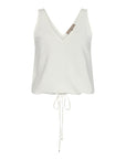 The Ryan Top in Off White, featuring its clean V-neckline and versatile drawstring waist detail.