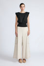 Selena Top in Black – Sleeveless cotton top with round neckline, semi-ruffled sleeves, and elasticized waistband.