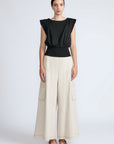 Selena Top in Black – Sleeveless cotton top with round neckline, semi-ruffled sleeves, and elasticized waistband.