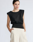 Selena Top in Black – Sleeveless cotton top with round neckline, semi-ruffled sleeves, and elasticized waistband.