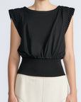 Selena Top in Black – Sleeveless cotton top with round neckline, semi-ruffled sleeves, and elasticized waistband.