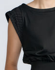 Selena Top in Black – Sleeveless cotton top with round neckline, semi-ruffled sleeves, and elasticized waistband.
