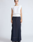 Selena Top in White – Soft cotton sleeveless top with round collar, ruffled arm details, and a gently cinched waist.