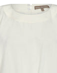 The Shelby Blouse in Off White, featuring its clean round neckline and versatile tie-hem detail.