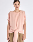 Front view of the Shelby Blouse in Rose, showcasing its classic round neckline and adjustable tie-hem.