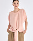 Front view of the Shelby Blouse in Rose, showcasing its classic round neckline and adjustable tie-hem.