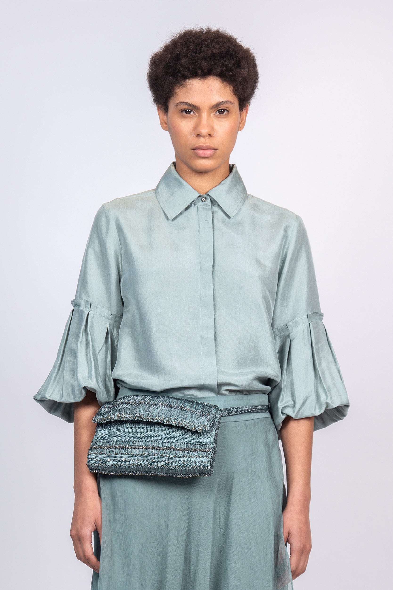 Sierra silk blouse in dark green with a sleek collar and balloon sleeves