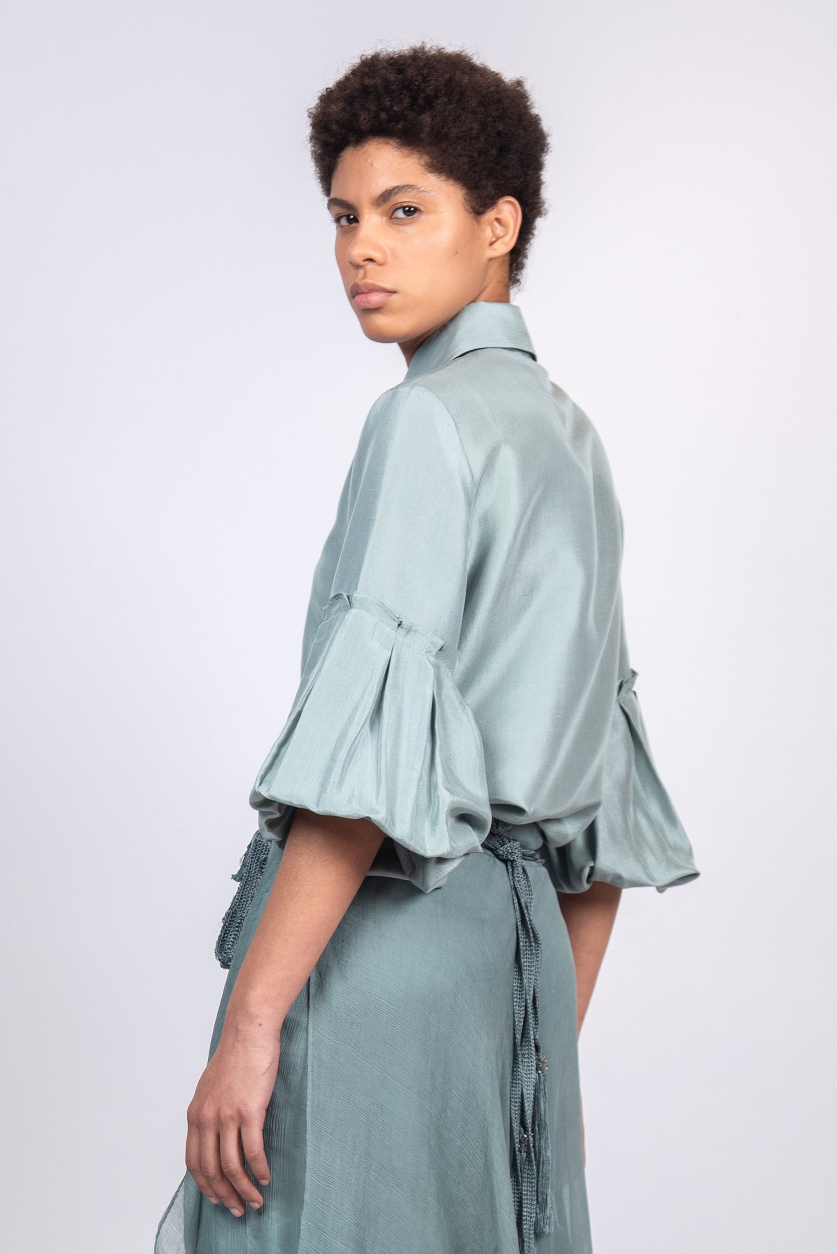Sierra silk blouse in dark green with a sleek collar and balloon sleeves