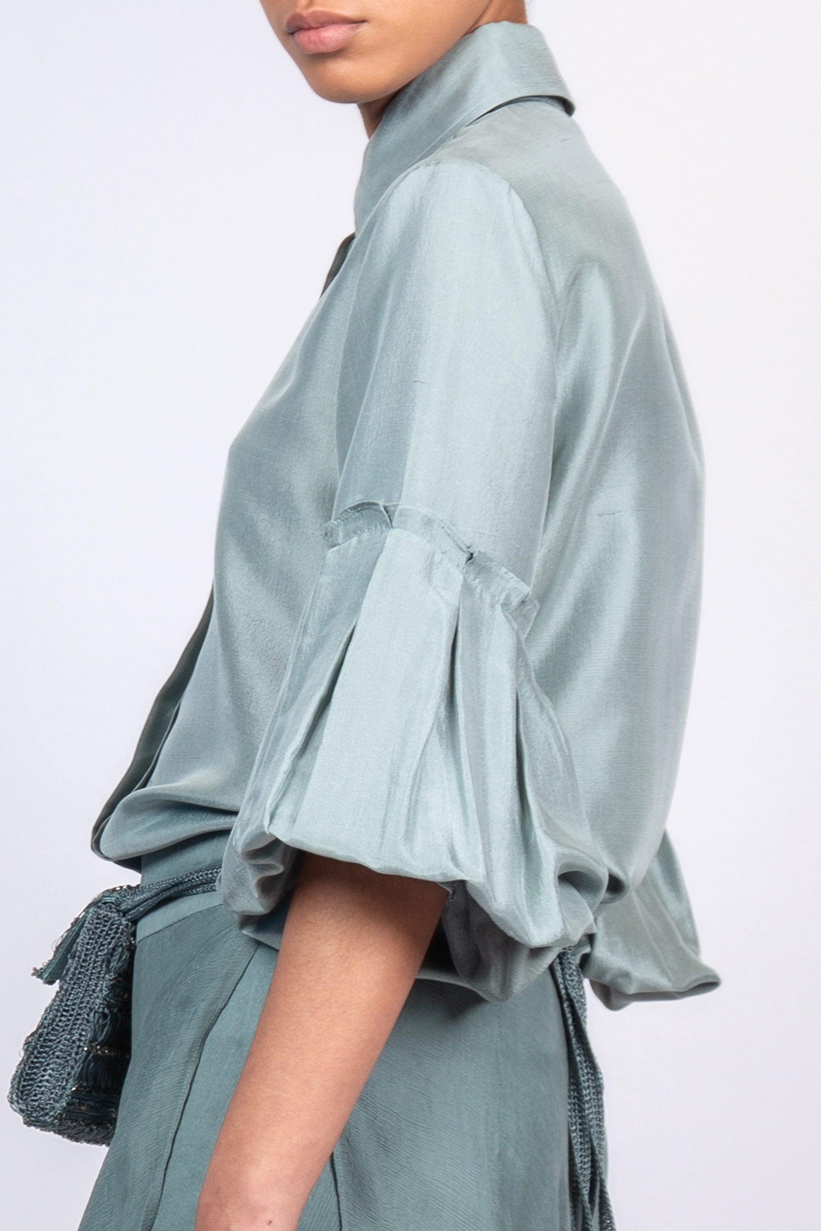 Sierra silk blouse in dark green with a sleek collar and balloon sleeves