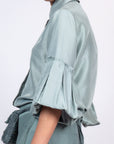 Sierra silk blouse in dark green with a sleek collar and balloon sleeves