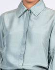 Sierra silk blouse in dark green with a sleek collar and balloon sleeves