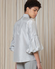 Sierra silk blouse in silver with balloon sleeves and hidden buttons