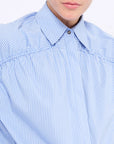 Front view of the Star Blouse in a classic light blue, showcasing its timeless tailoring.