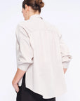 Clean back silhouette of the Star Blouse, a portrait of minimalist elegance.