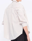 Clean back silhouette of the Star Blouse, a portrait of minimalist elegance.
