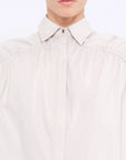 Front view of the Star Blouse in Sand, showcasing its classic collar and the elegant drape of its Peruvian cotton fabric.