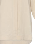 Tatiana Blouse in Ecru featuring a sleek shirt collar, hidden button placket, and 3/4 puff sleeves with semi-elasticated cuffs.