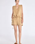 The Valencia Blouse in a rich Camel hue, showing its sleeveless design and premium linen blend.