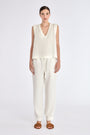 The Valencia Blouse in Off White, featuring its clean sleeveless design and premium linen blend.