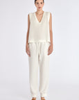 The Valencia Blouse in Off White, featuring its clean sleeveless design and premium linen blend.