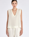 The Valencia Blouse in Off White, featuring its clean sleeveless design and premium linen blend.