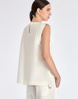 Elegant back silhouette of the Valencia Blouse in Off White.