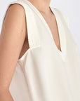 Detailed shot of the delicate hemstitch embroidery on the armhole of the Off White Valencia Blouse.