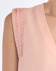 Close-up of the artisanal hemstitch embroidery on the armhole of the Rose Valencia Blouse