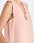 Close-up of the artisanal hemstitch embroidery on the armhole of the Rose Valencia Blouse.