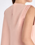 Close-up of the artisanal hemstitch embroidery on the armhole of the Rose Valencia Blouse.