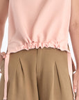 Front view of the Valencia Blouse in a delicate Rose hue, showcasing its premium linen blend fabric.