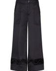 The Viena Trouser in essential black, showcasing its powerful wide-leg tailoring.