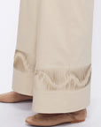Close-up of the architectural, raised embellishment on the hem of the Pristine Viena Trouser.