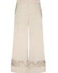 Front view of the Viena Trouser in pristine white, highlighting its sculptural design details.