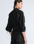 Zoe Jacket in Black – 100% cotton jacket with flap patch pockets, hidden buttons, long sleeves, and an adjustable drawstring hem.
