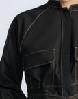 Zoe Jacket in Black – 100% cotton jacket with flap patch pockets, hidden buttons, long sleeves, and an adjustable drawstring hem.
